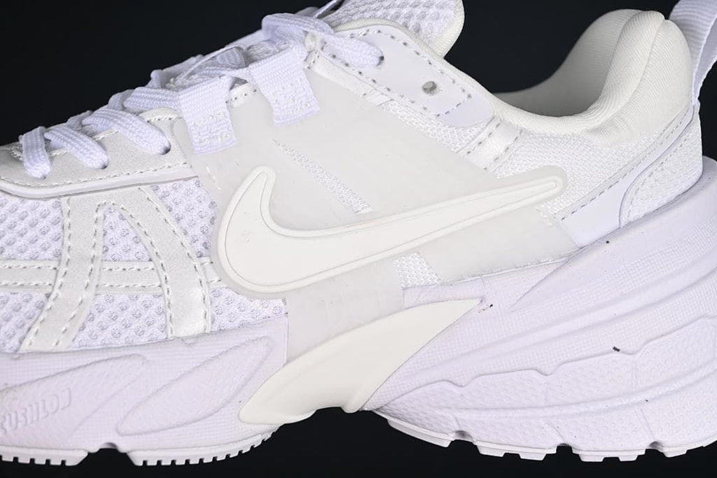 Close-up of the side logo, mesh panels, overlays, and sculpted sole