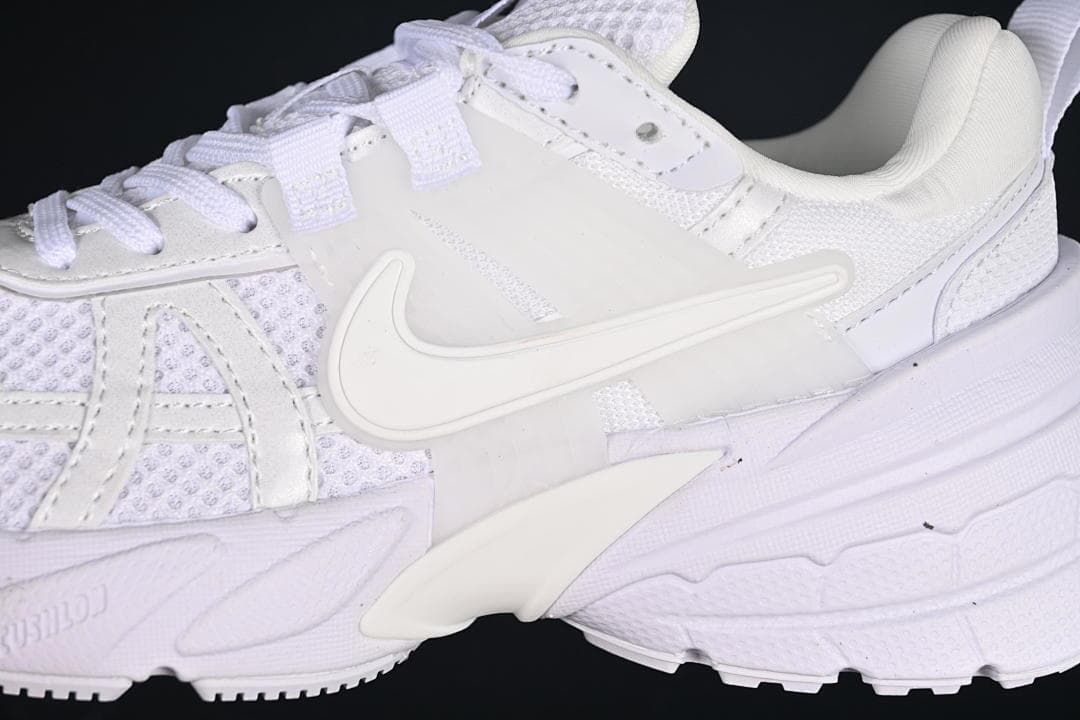 Close-up of the side logo, mesh panels, overlays, and sculpted sole