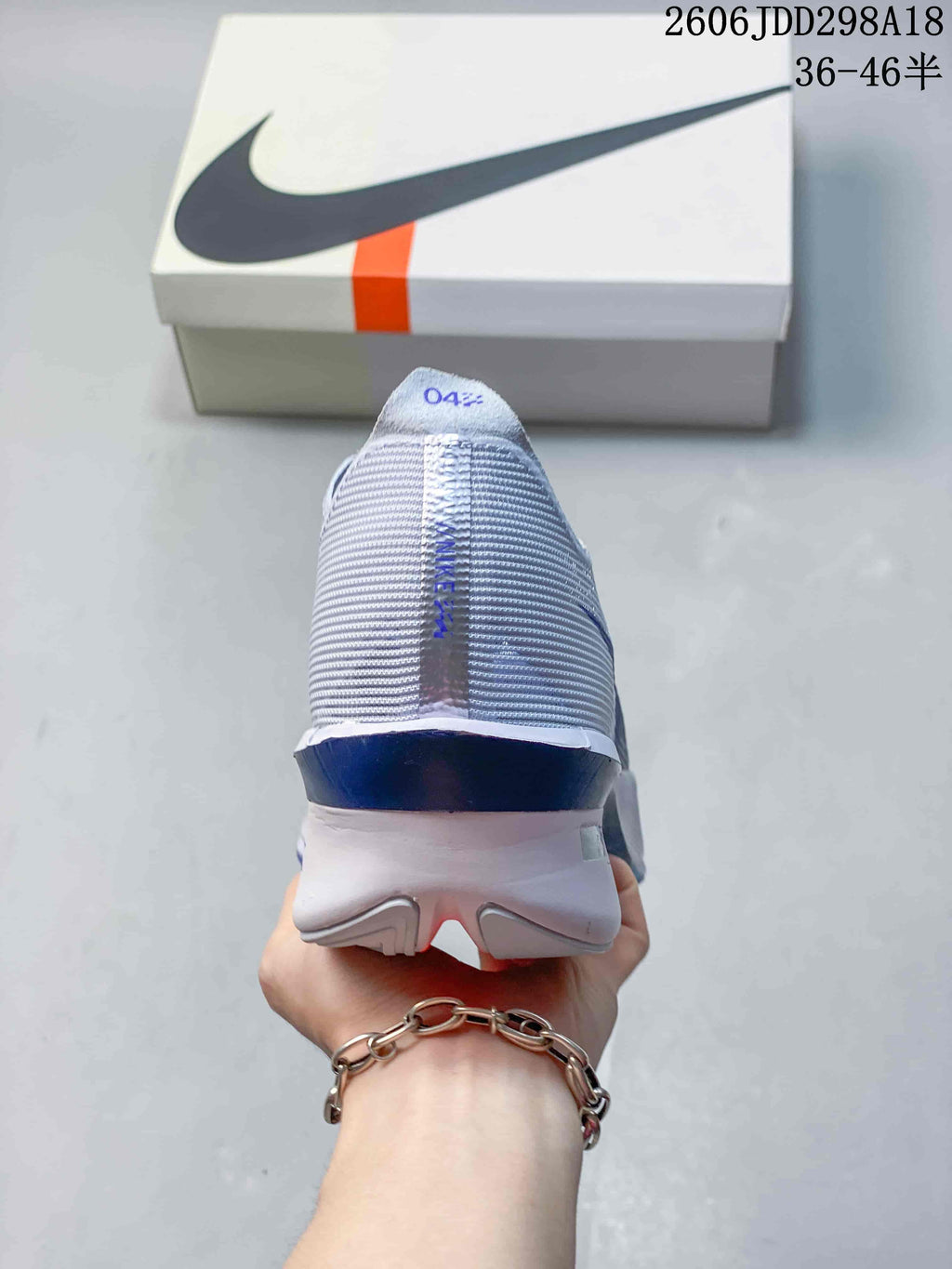 Rear view of the running shoe showing the heel and midsole.