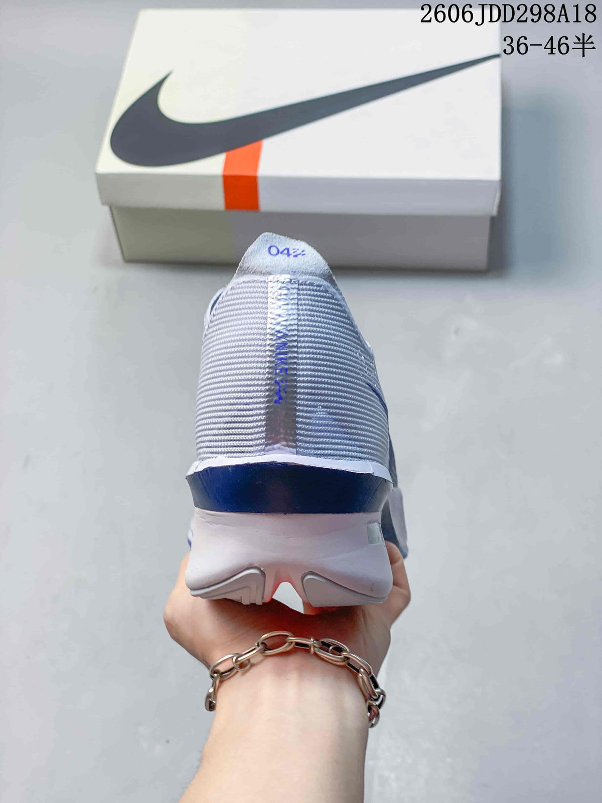 Rear view of the running shoe showing the heel and midsole.