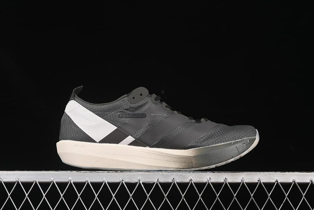 Side profile of the shoe with patterned upper and contrasting sole