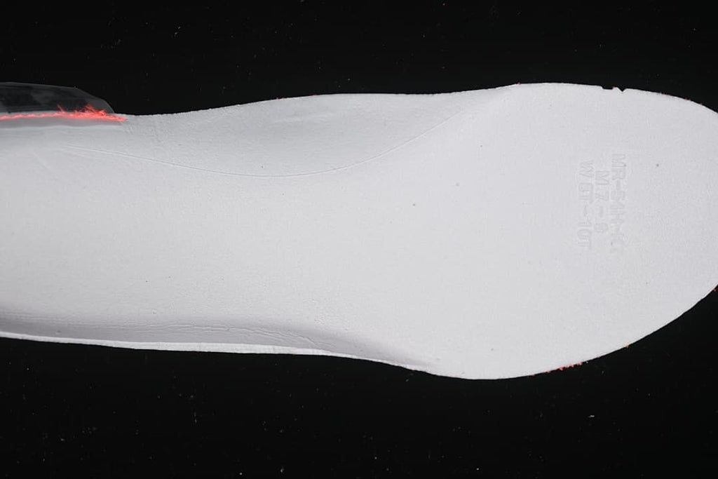 Underside view of the shoe's white insole