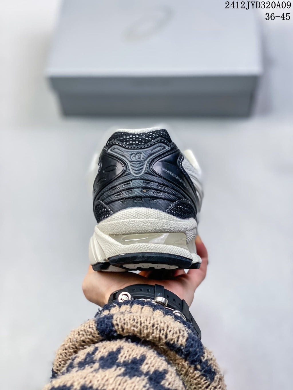 Rear view showing the dark heel panel and layered midsole.