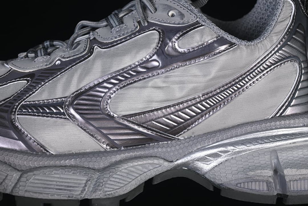 Close-up of the layered grey side panels and sculpted sole.