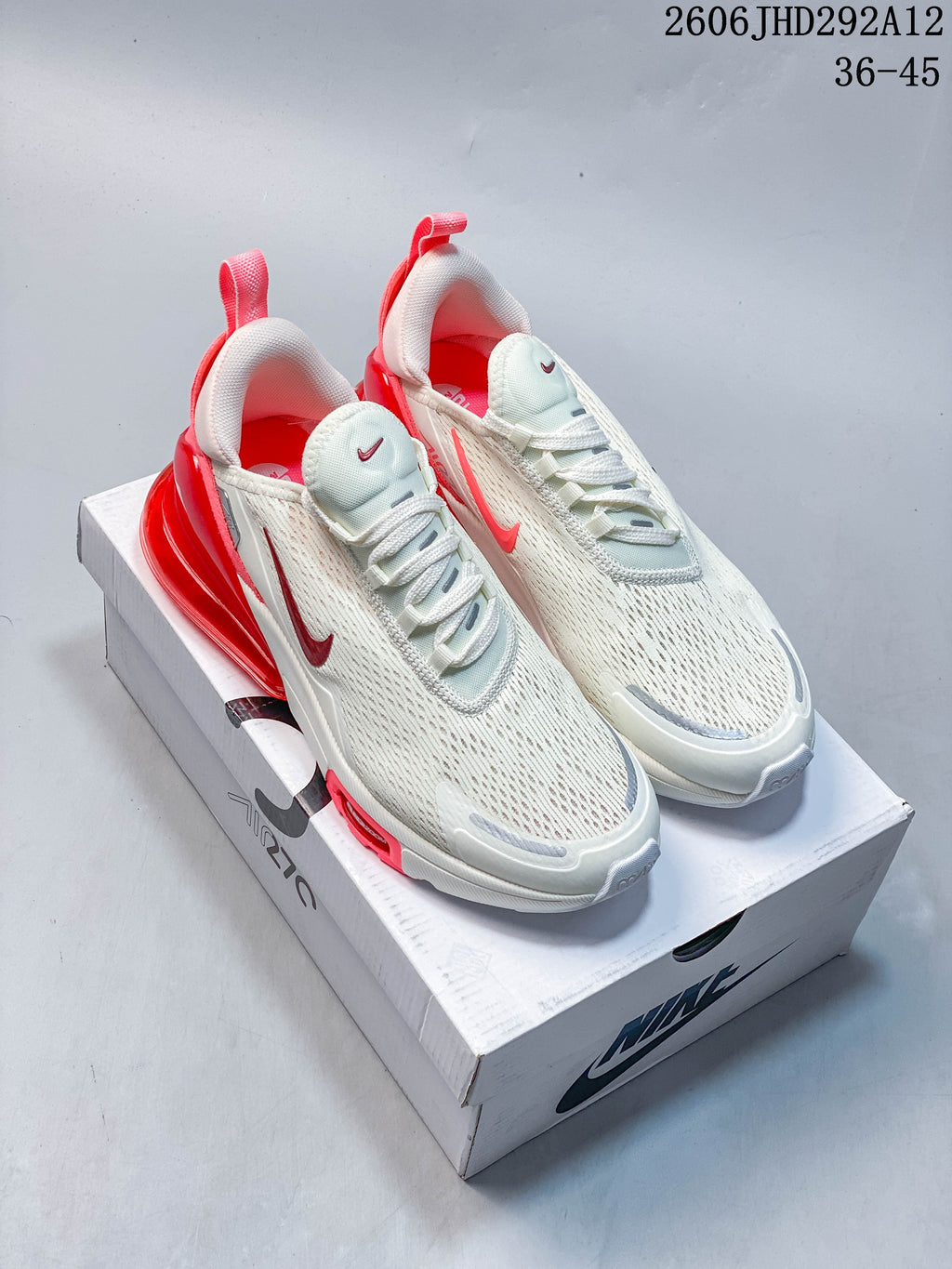 Four Nike Air Max 270-style sneakers shown from the side in white with red, green, gray, and pink accents.
