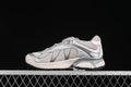 Side profile of silver and off-white Salomon XT-Whisper sneakers on a dark background.