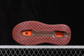 Brown and orange sneaker outsole showing a patterned rubber tread and two visible Air Zoom units.