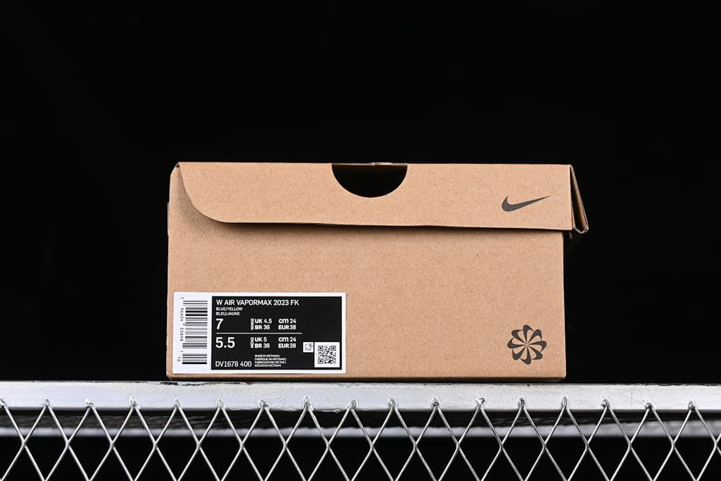 Shoebox label identifying the pictured pair as W Air VaporMax 2023 FK in blue, style DV1678-400.
