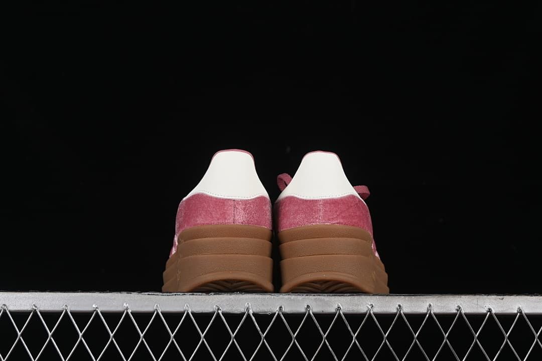 Rear view of both sneakers showing the white heel tabs and platform soles