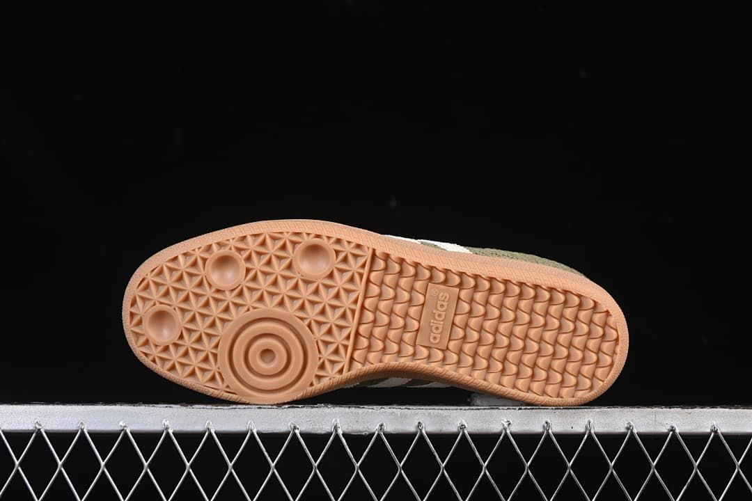 Underside of the sneaker showing the gum-colored patterned outsole