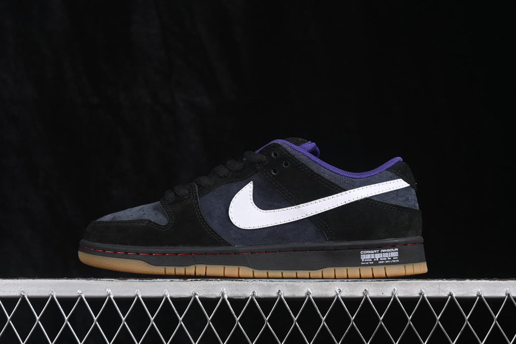 Side profile of a Nike SB Dunk Low sneaker showing the dark upper, white Swoosh, red midsole accent, and gum outsole.