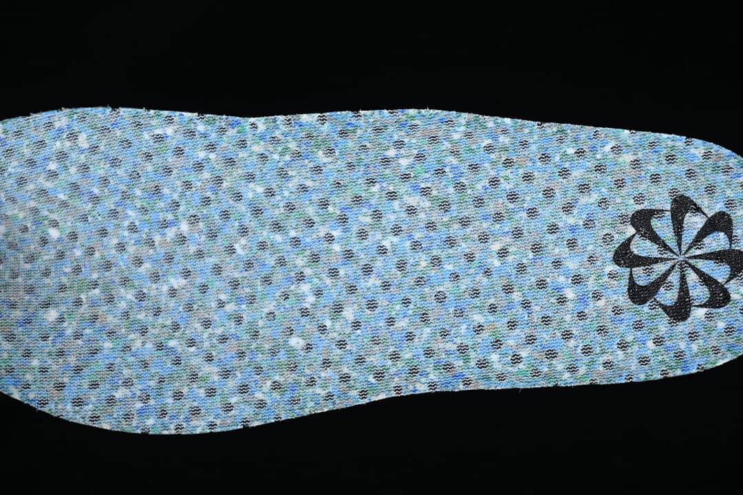 Reverse side of the patterned insole with a small graphic near the heel