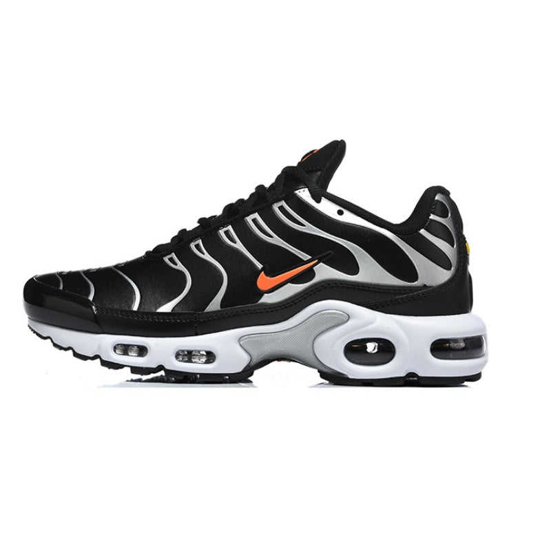 Black and white Nike Air Max Plus sneaker with an orange swoosh.