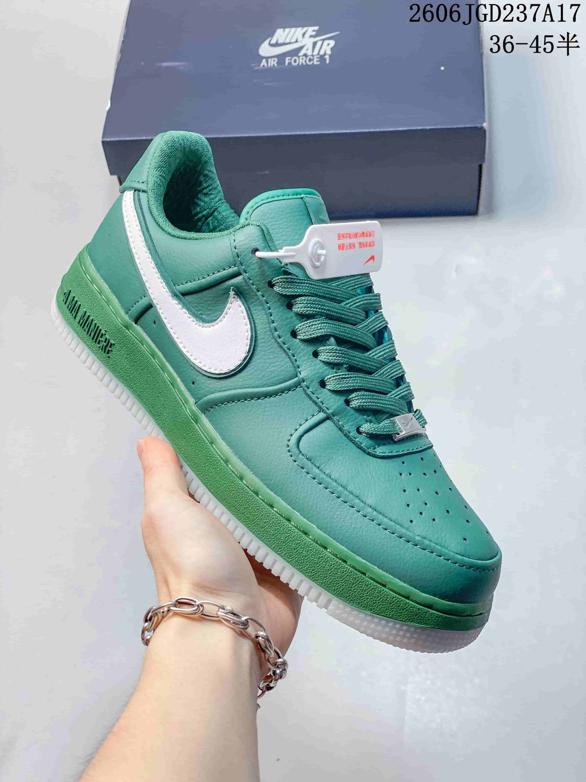 Angled view of a teal low-top sneaker with white Swoosh and green midsole.