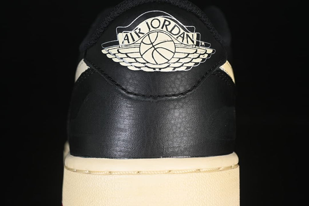 Rear view showing the Air Jordan Wings logo and sail-colored midsole