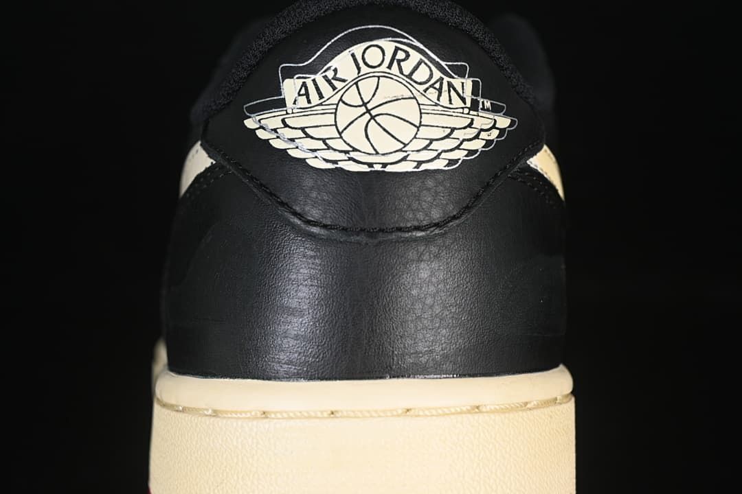 Rear view showing the Air Jordan Wings logo and sail-colored midsole
