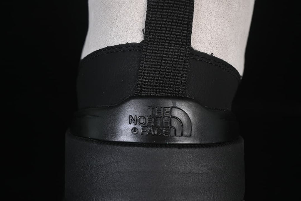 Rear view showing heel pull tab and molded logo panel