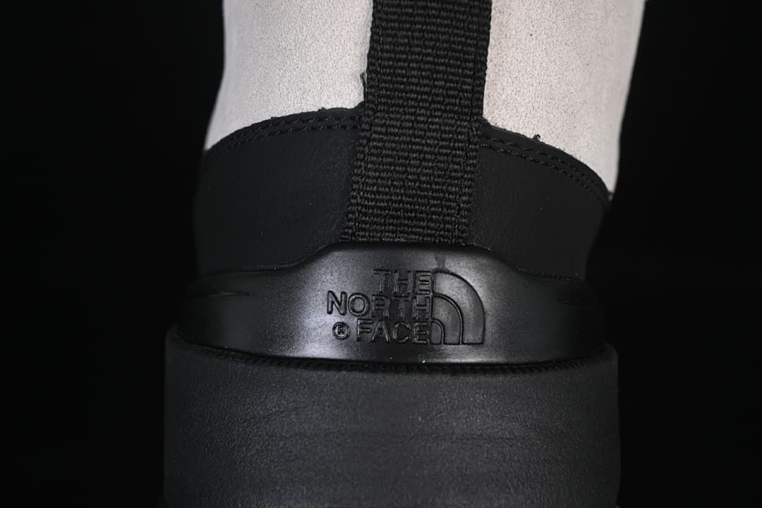 Rear view showing heel pull tab and molded logo panel