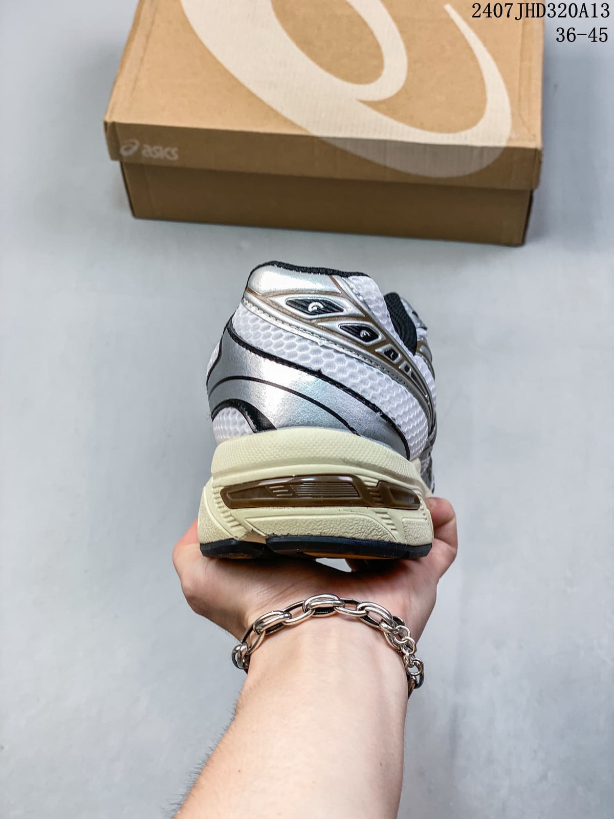 Rear view of the silver and white ASICS GEL-1130 sneaker with cream outsole