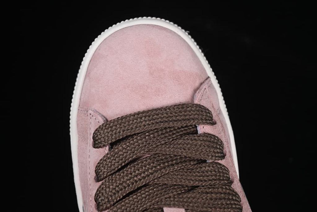 Top view of the pink toe and dark brown laces.