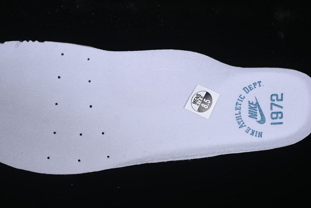 Insole detail with a visible US men's size 8.5 sticker