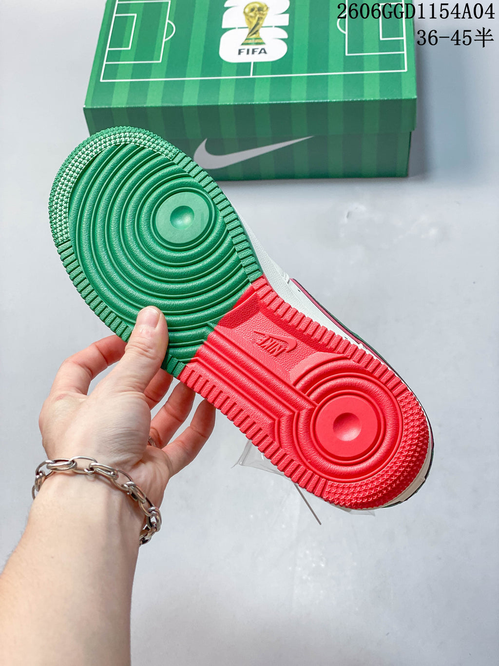 Close-up of the sneaker outsole with green and red sections