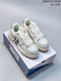 Pair of white MLB Chunky Liner low-top sneakers with graphic side details, shown on a shoebox