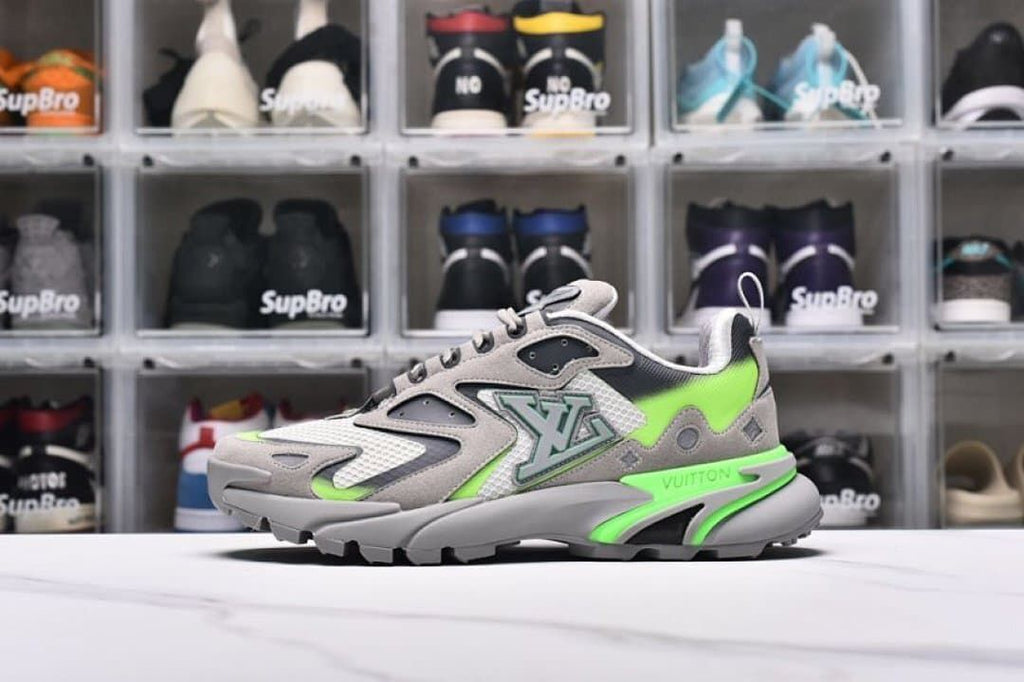 Side view of a gray and lime green chunky low-top sneaker