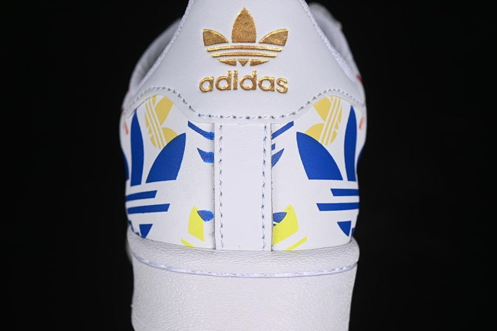Rear view showing colorful heel graphics and gold Trefoil branding