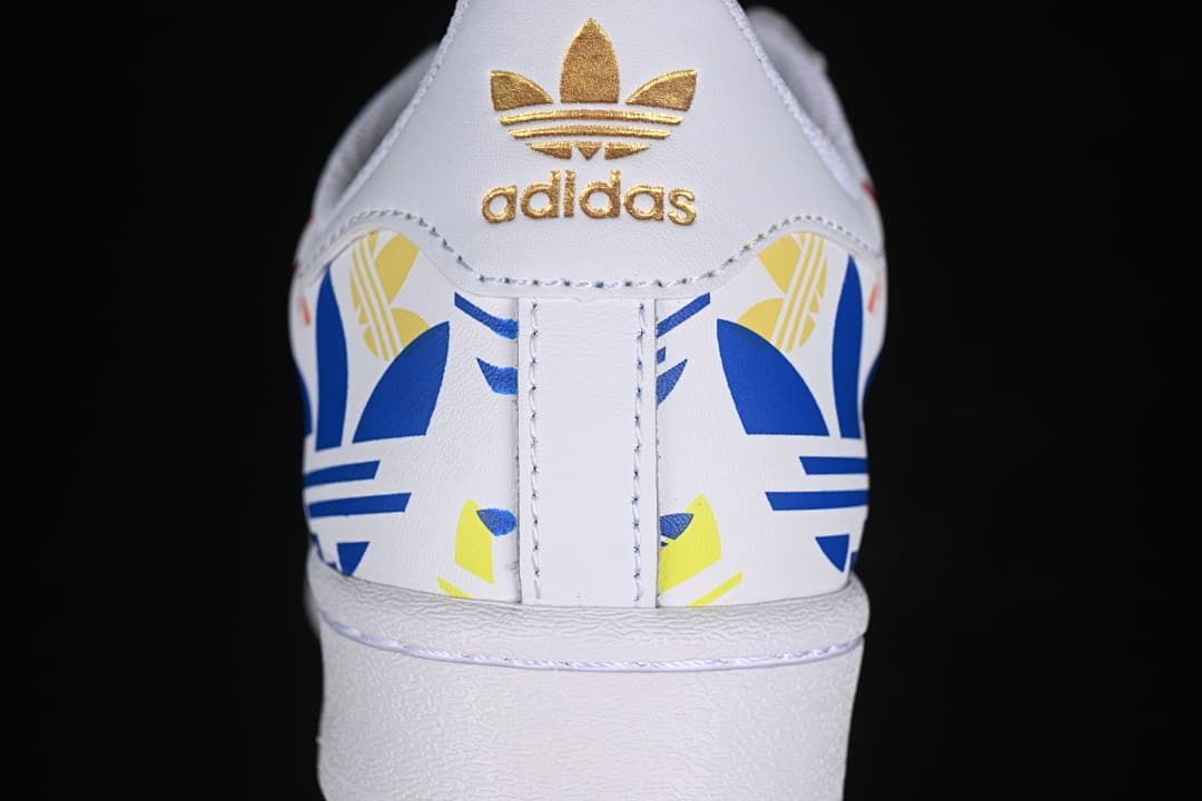 Rear view showing colorful heel graphics and gold Trefoil branding
