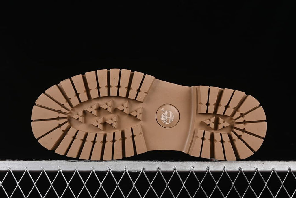Underside of a boot showing the lugged tread pattern