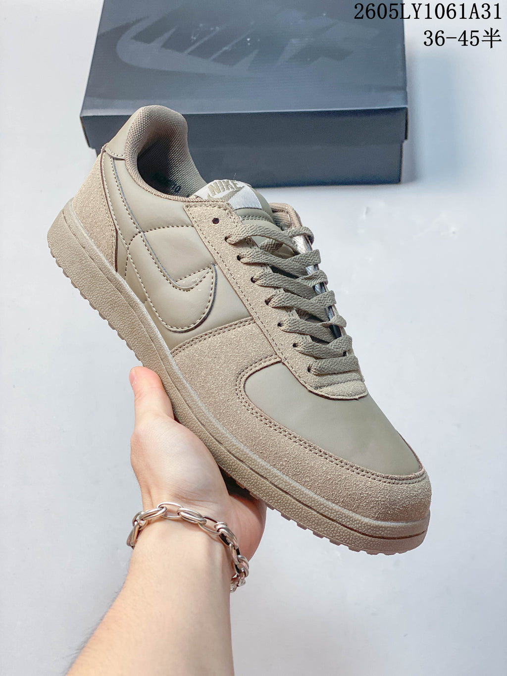Angled side view of the taupe Nike Field General 82 SP sneaker