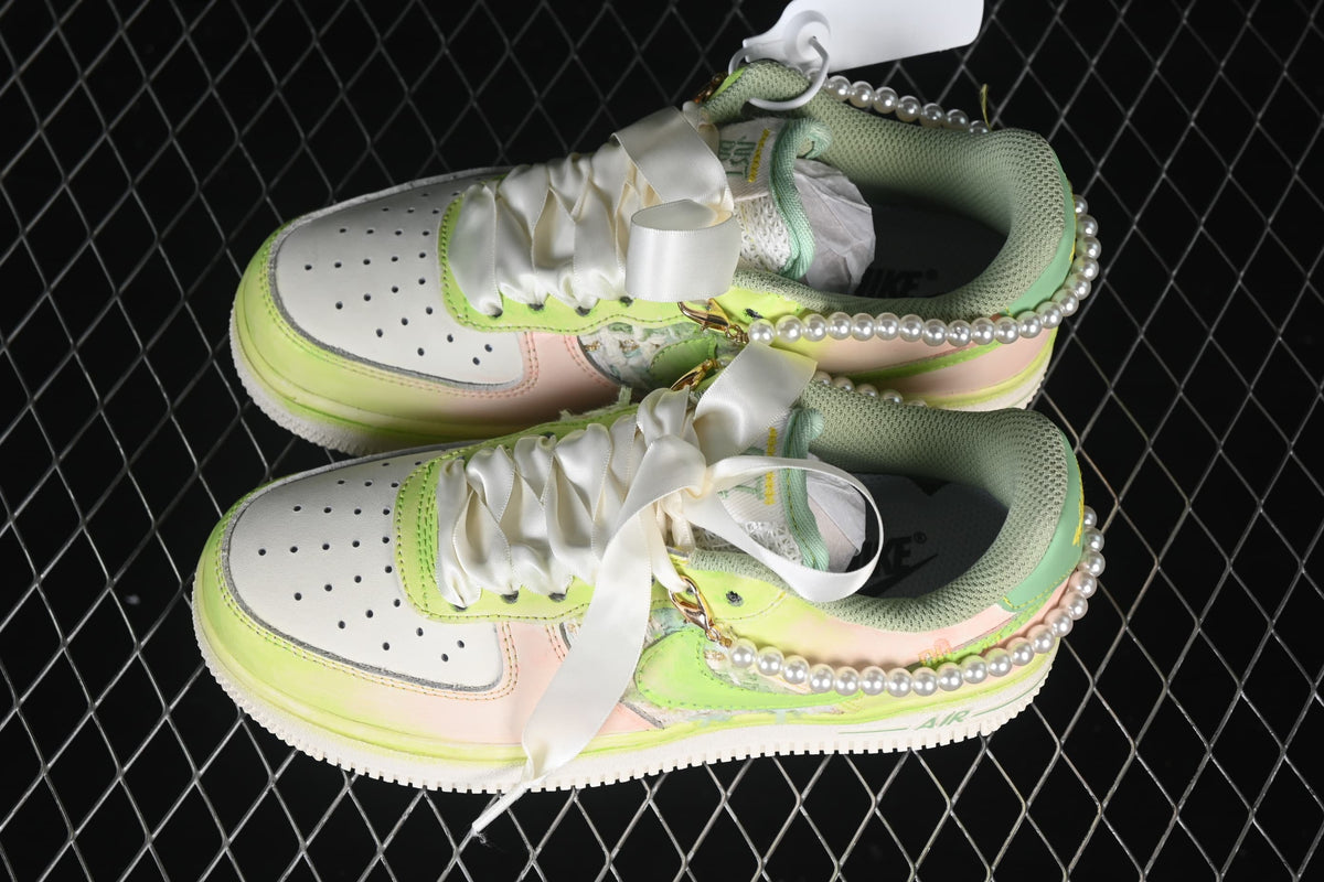 Top view of the pair highlighting the laces and pastel color blocking