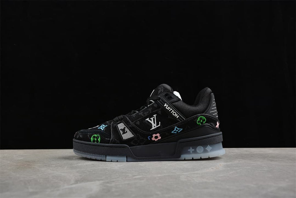 Black Louis Vuitton low-top sneaker with colorful motifs, shown in profile