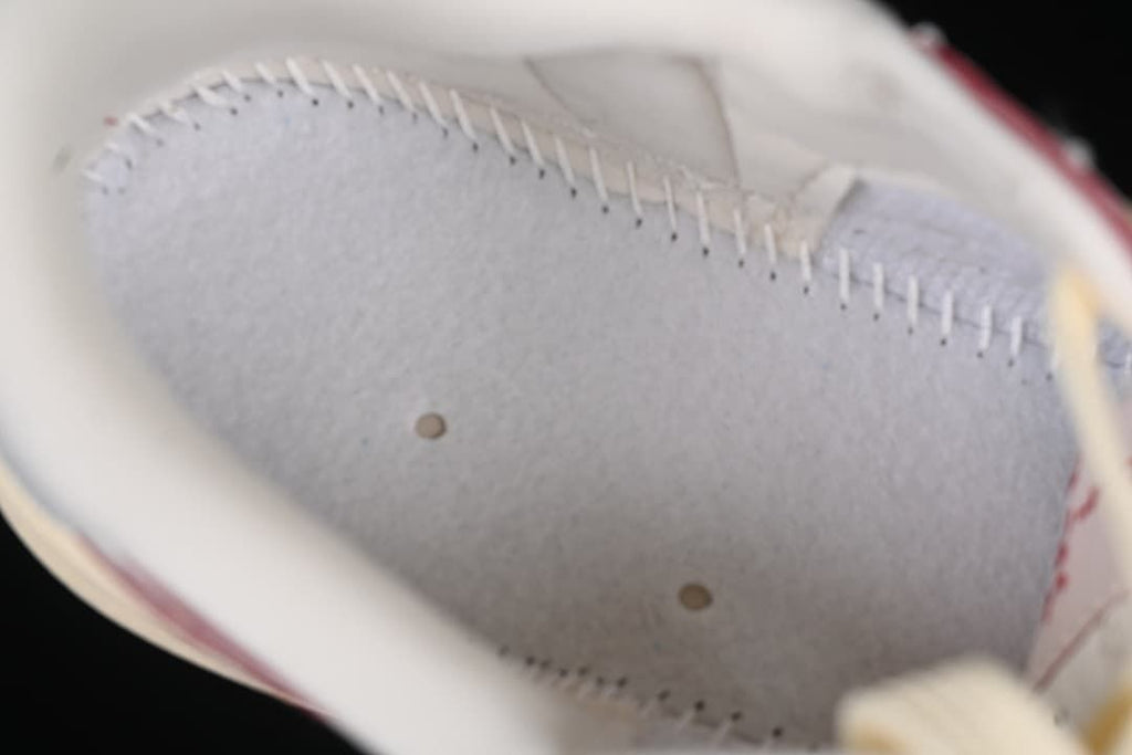 Close-up inside the sneaker showing interior lining and stitching.