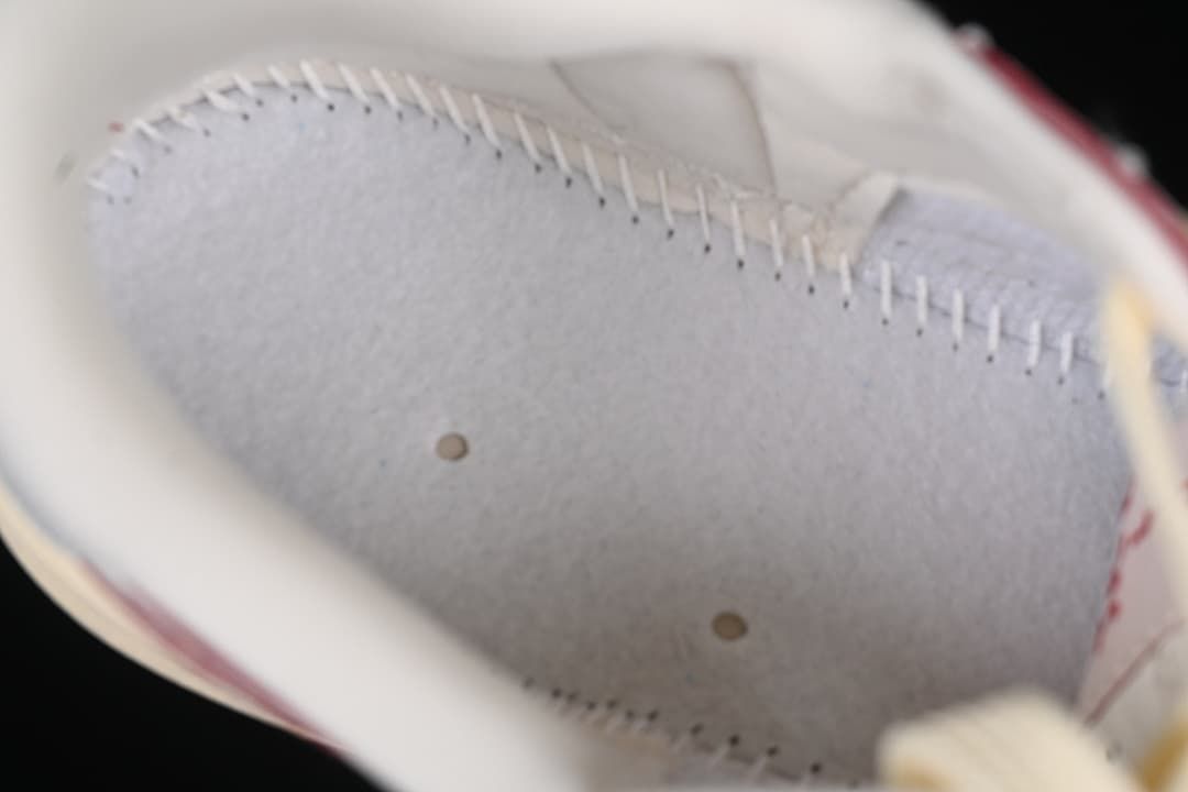 Close-up inside the sneaker showing interior lining and stitching.