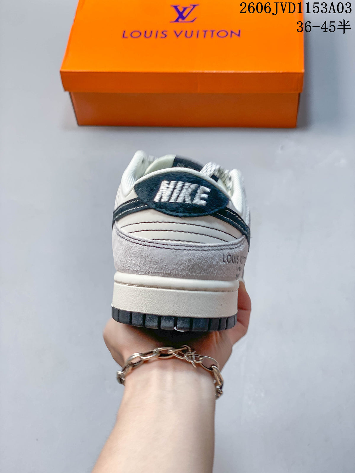 Rear view of a sneaker showing a dark heel overlay and white midsole