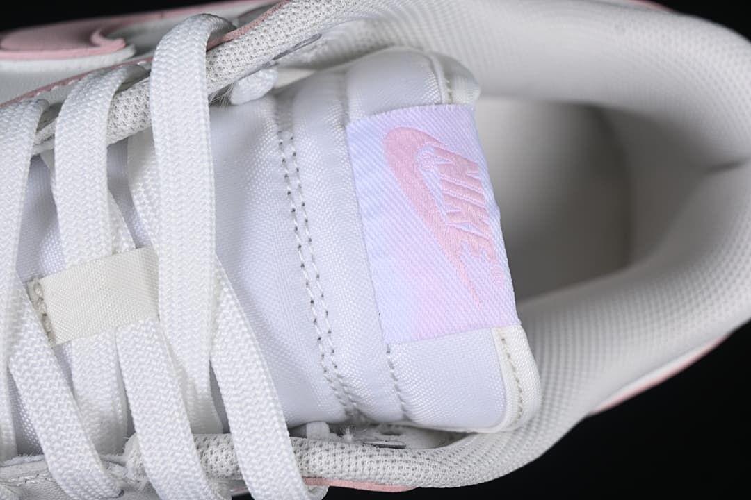Close-up of tongue label and white laces