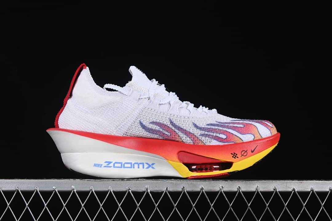 Side profile showing the white upper, colorful graphics, and sculpted midsole