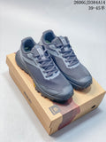 Pair of gray KOLON SPORT City Lux sneakers displayed on a shoebox