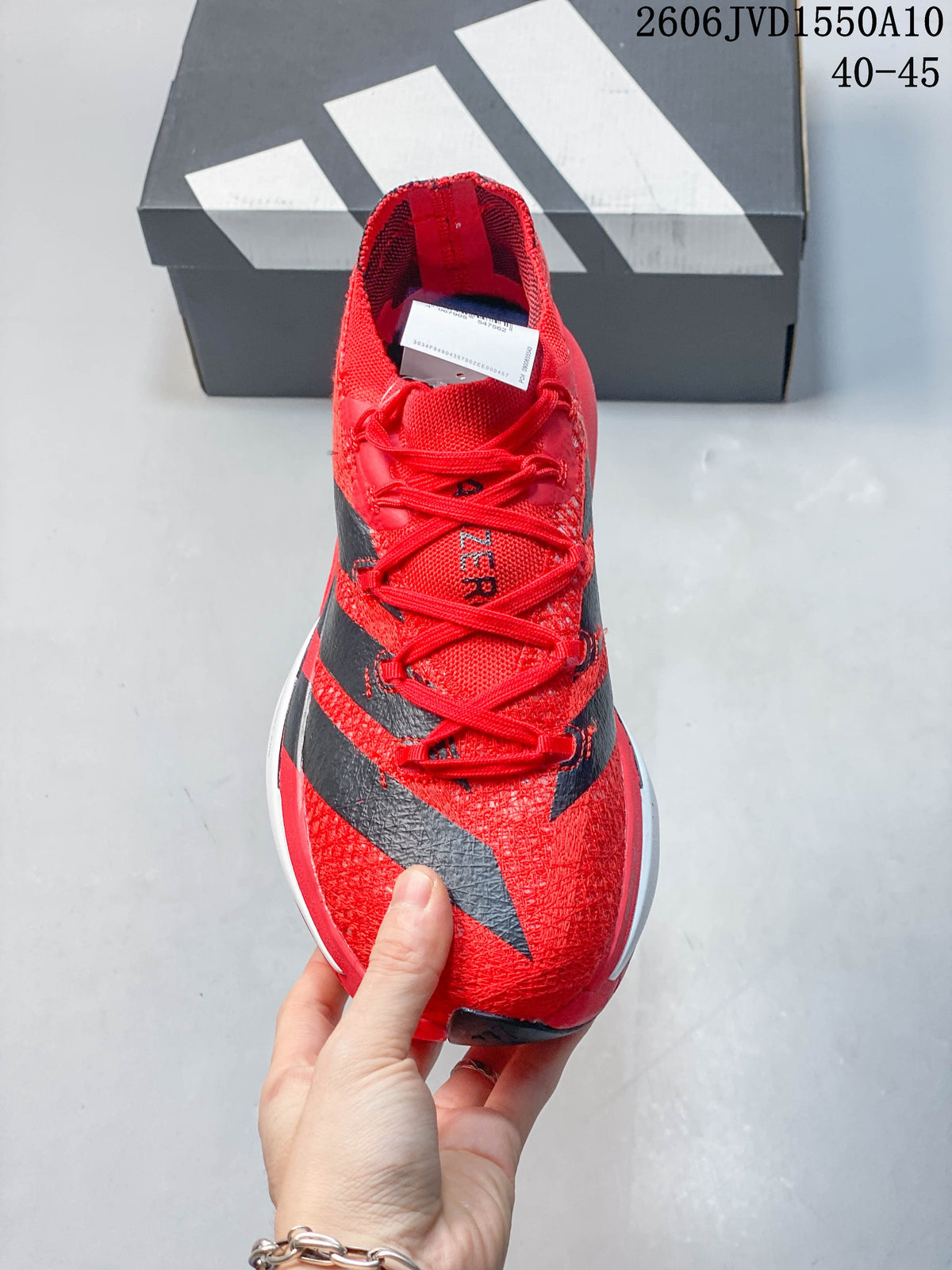 Front view of a red running shoe with black side stripes and red laces.