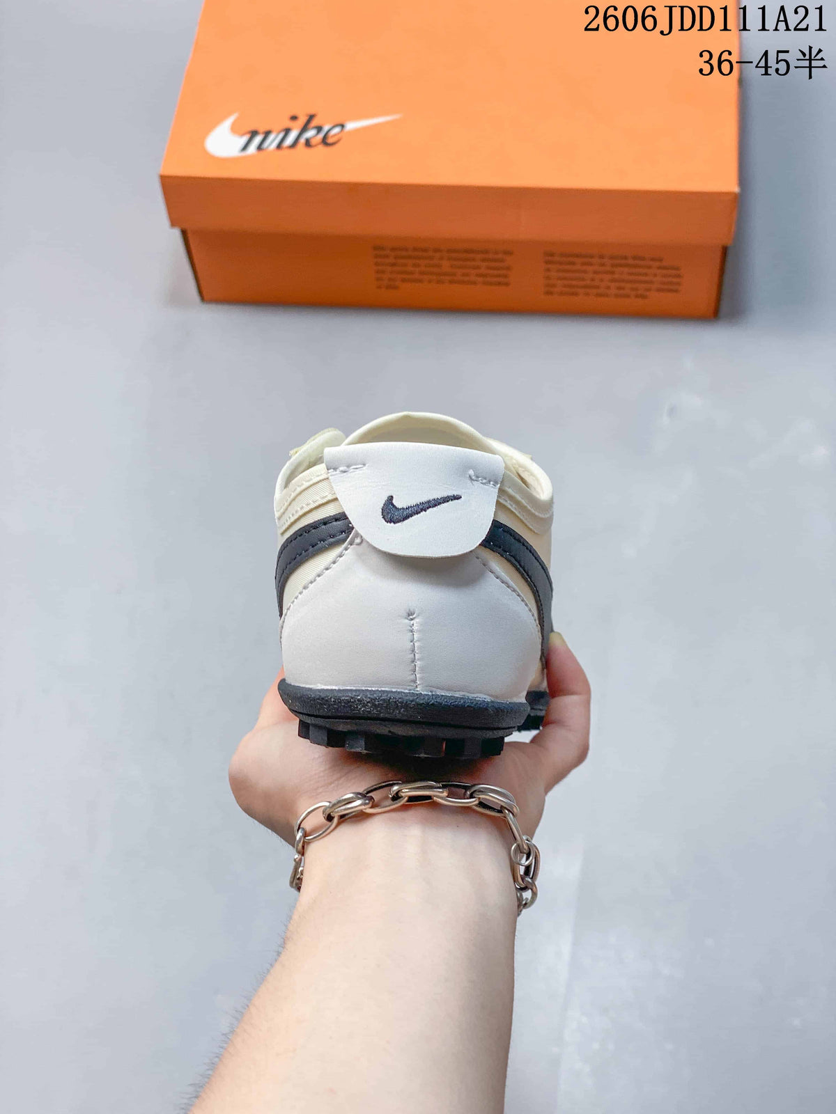 Rear view of an off-white Nike Moon Shoe OG Summit sneaker with dark heel detailing
