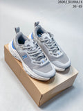 Pair of gray On Cloudpulse Next sneakers with blue accents shown on a box
