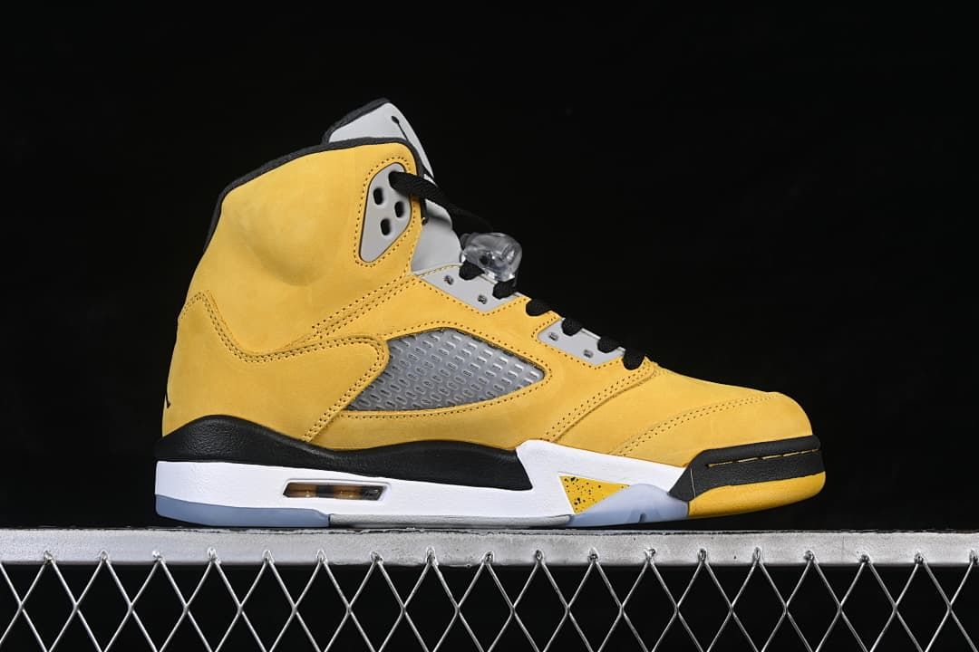 Side profile showing the yellow upper, grey side panel, and white midsole