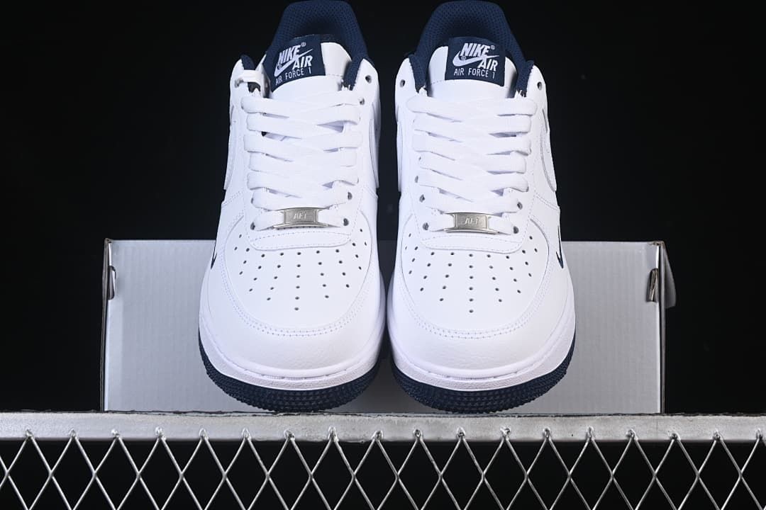 Front view of the pair showing the perforated toe panels and navy outsole