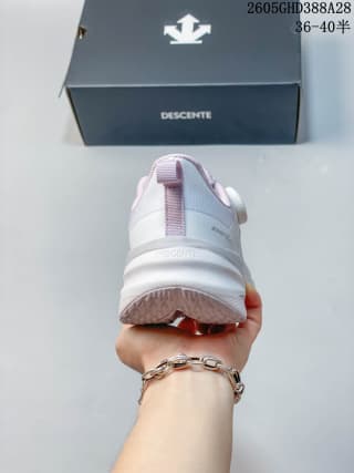 Rear view showing the heel and outsole of a Descente sneaker