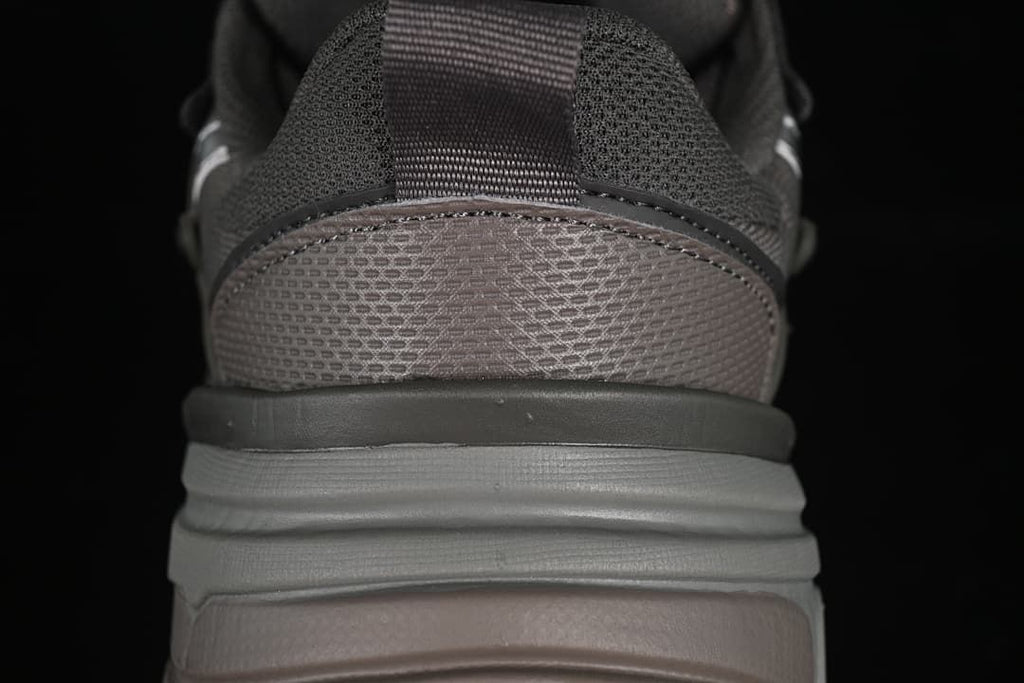 Rear view showing the mesh heel, pull tab, and layered sole