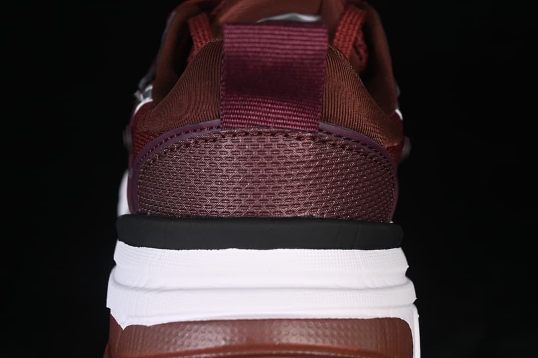 Rear view highlighting the mesh heel, pull tab, and layered sole