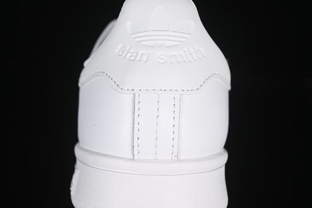 Rear view of the white sneaker with Stan Smith heel branding