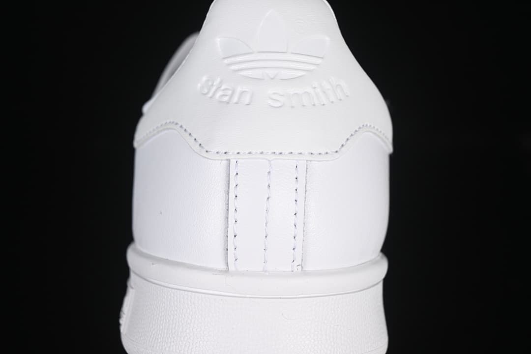 Rear view of the white sneaker with Stan Smith heel branding
